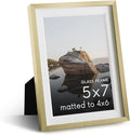 HAUS AND HUES 5x7 Picture Frame with Real Glass & Gold Premium-Grade Metal Matted to 4x6 - Aluminum 5x7 Picture Frame - Includes Easel Back, Hanging Kit - Ideal for Home, Office (5x7 in, Gold)